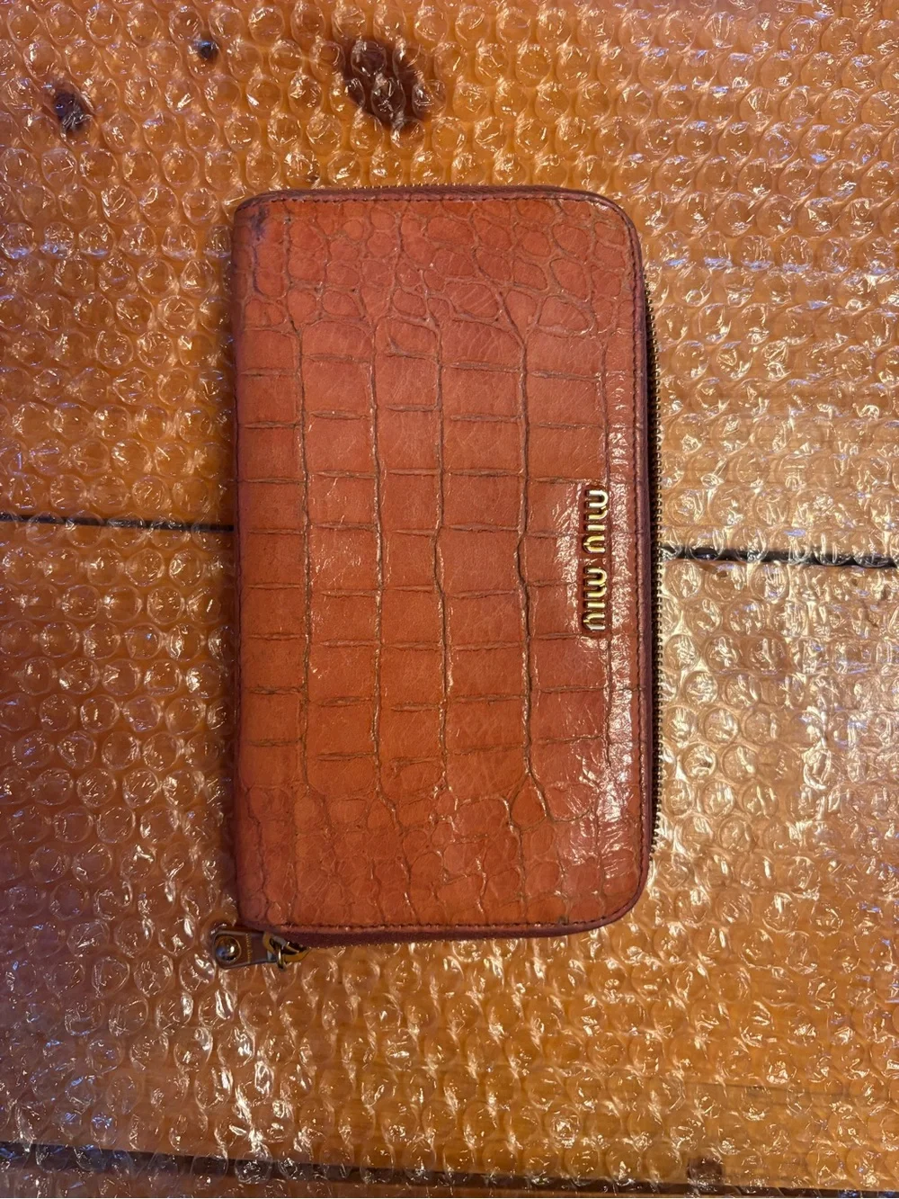 Authentic Miu Miu Croc-Embossed Zip Wallet in Peachy Pink.